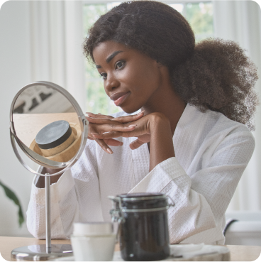 Woman looking at a mirror